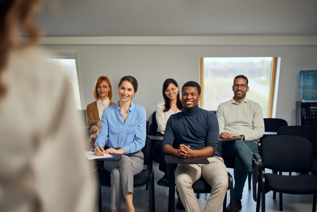 Multi-ethnic business professionals participating in a training program in their office.